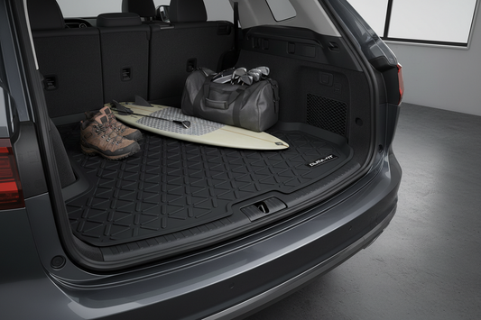 Custom-fit rubber cargo liner protecting SUV trunk from spills and mud