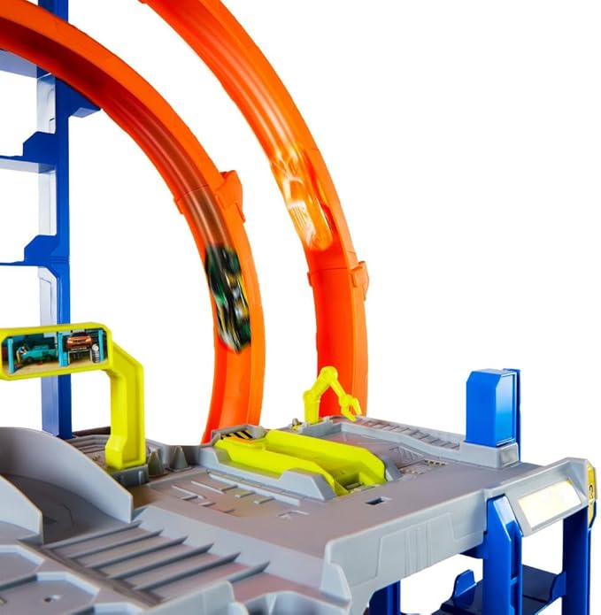 Hot Wheels Toy Car Track Set with Die-Cast Car & Helicopter, 2 Loops, Storage for 36 1:64 Scale Vehicles, Speed Snap Adapters, Mega Loop Garage