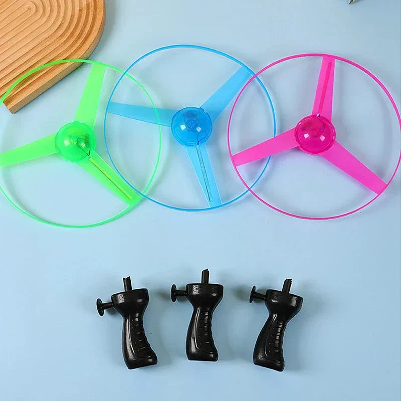 Pull Wire Glow UFO – Spinning LED Flyer Toy for Kids Outdoor Fun